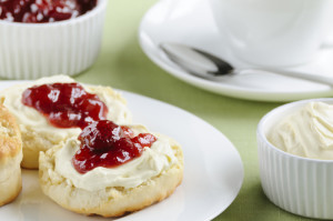 Whip the cream to a smooth but stiff consistency and serve with your favourite jam